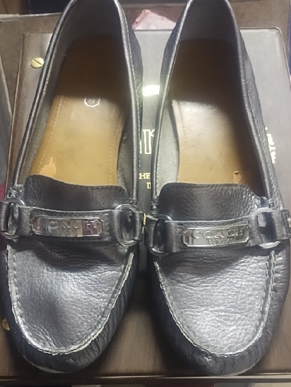 #0142 Coach Black Pebbled Leather Slip-On Loafers with Metal Logo